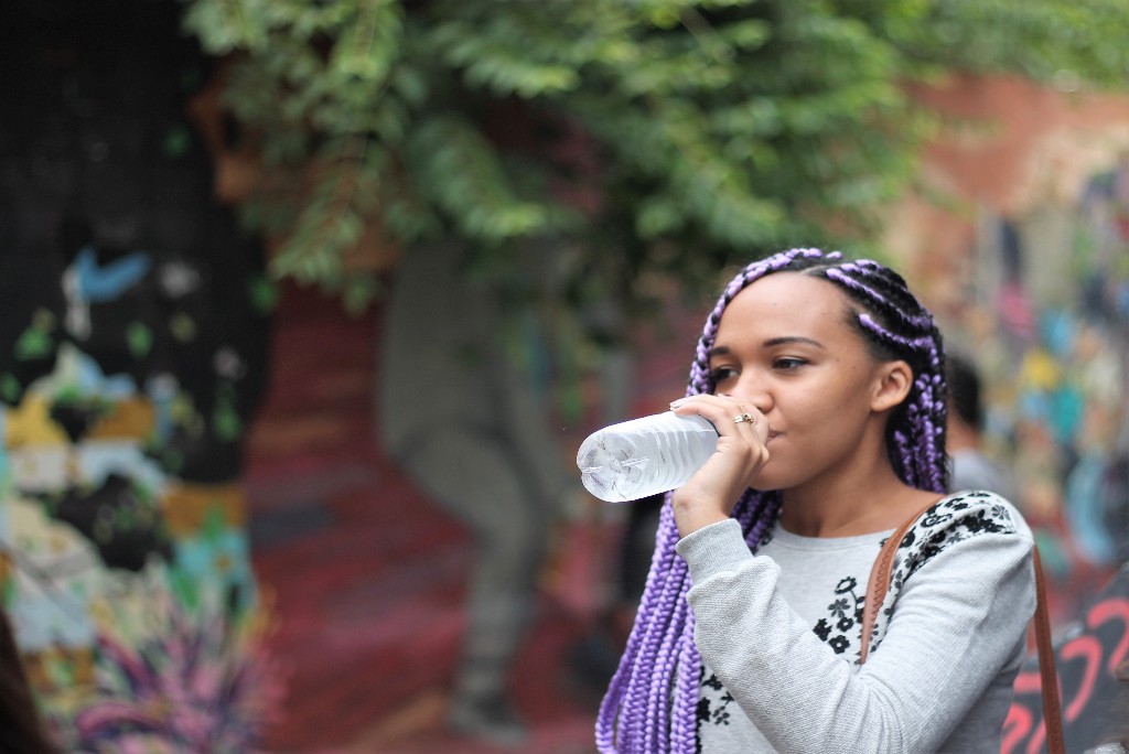 lady drinking water from a bottle